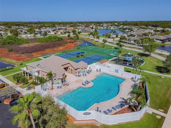 an aerial view of a house with a ocean view
