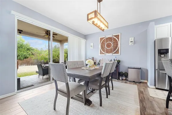 a view of a dining room with furniture window and outside view