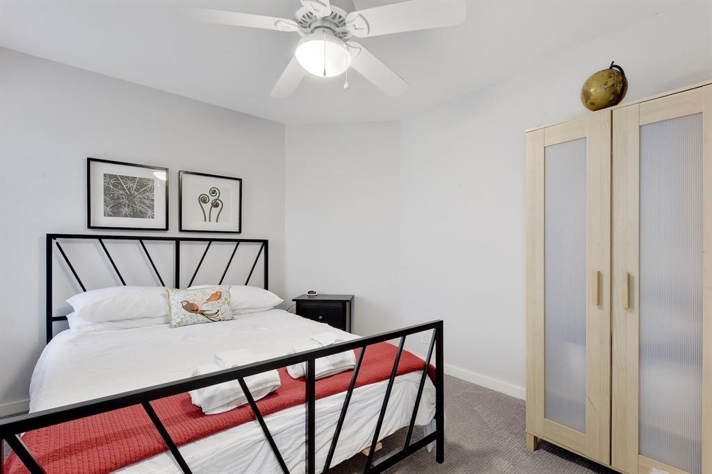 3201 South 5th Street, Unit B Austin, TX 78704 - Photo 12 of 25 a bedroom with a bed and a painting on the wall