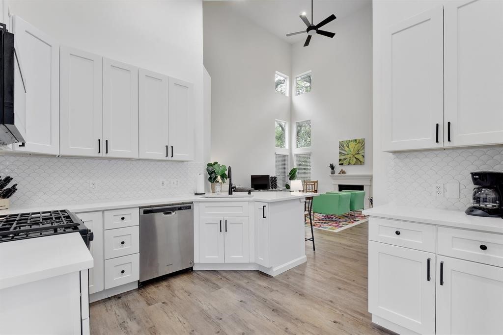 3201 South 5th Street, Unit B Austin, TX 78704 - Photo 17 of 25 a kitchen with white cabinets and white appliances