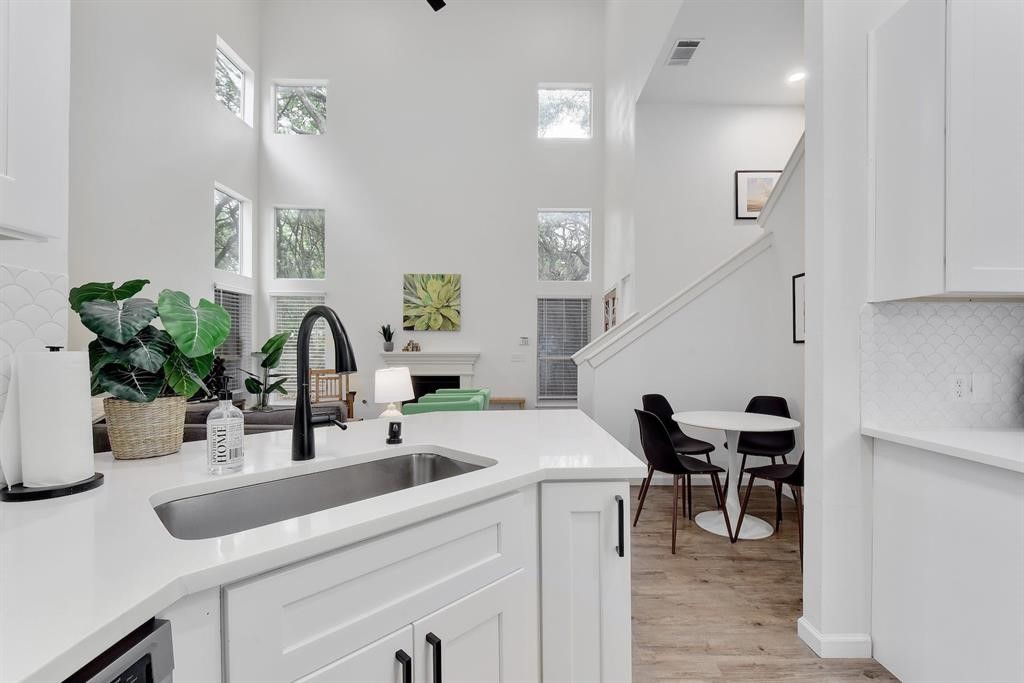 3201 South 5th Street, Unit B Austin, TX 78704 - Photo 19 of 25 a kitchen with a sink and a refrigerator