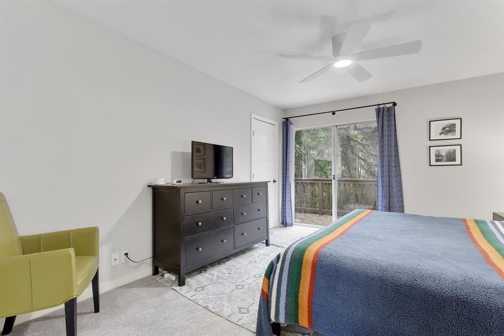 3201 South 5th Street, Unit B Austin, TX 78704 - Photo 21 of 25 a bedroom with a bed and a television