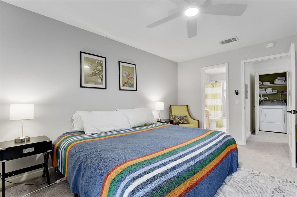 3201 South 5th Street, Unit B Austin, TX 78704 - Photo 22 of 25 a bedroom with a bed and a lamp