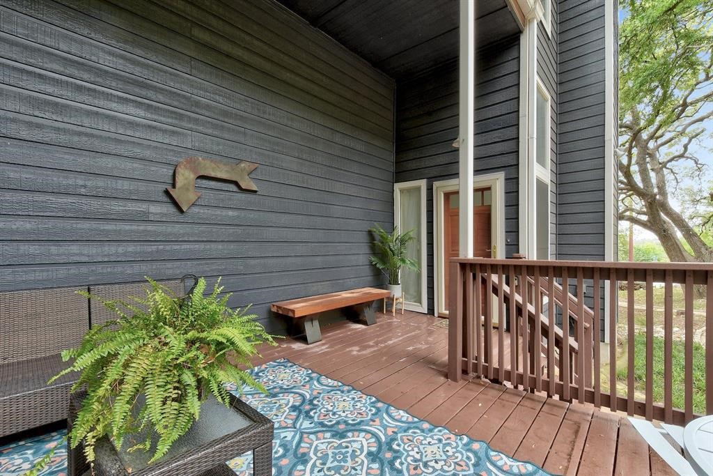 3201 South 5th Street, Unit B Austin, TX 78704 - Photo 5 of 25 a balcony with table and chairs with potted plants