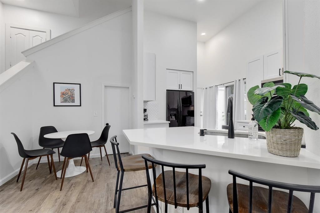 3201 South 5th Street, Unit B Austin, TX 78704 - Photo 10 of 25 a dining room with furniture and potted plant