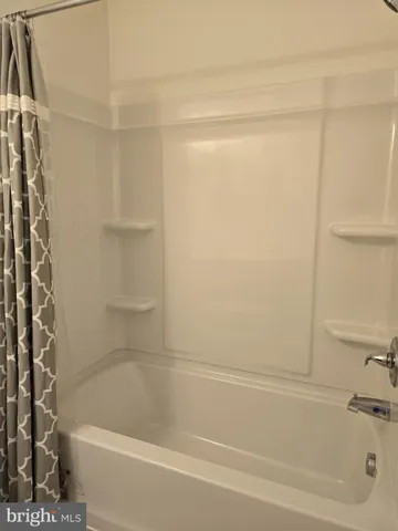 a bathroom with a sink toilet and mirror