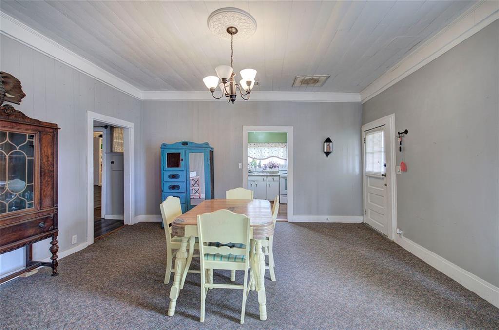 401 Edison Street Menlo, GA 30731 - Photo 11 of 34 a view of a dining room with furniture and chandelier