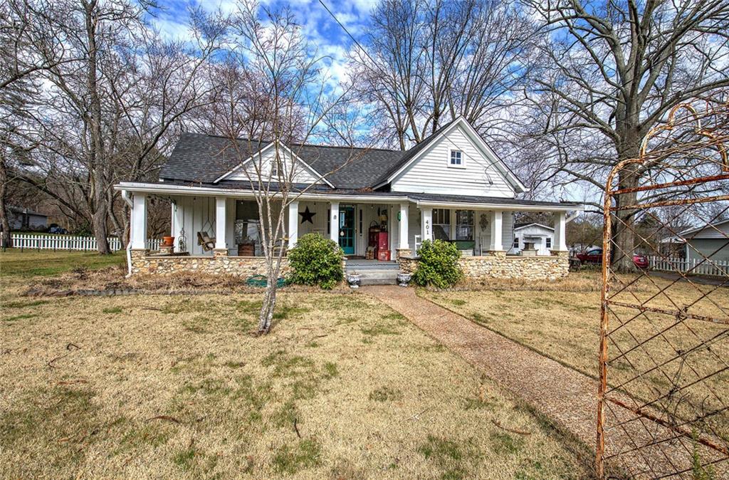 401 Edison Street Menlo, GA 30731 - Photo 2 of 34 a front view of a house with a yard and trees
