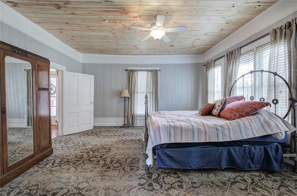 401 Edison Street Menlo, GA 30731 - Photo 21 of 34 a bedroom with a bed table and two large mirror