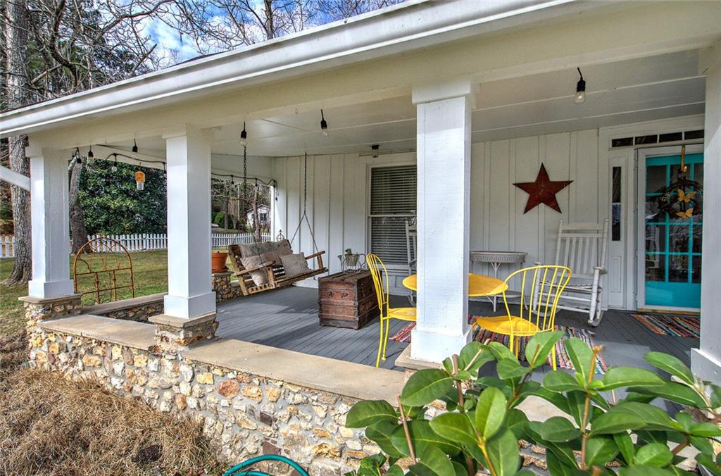 401 Edison Street Menlo, GA 30731 - Photo 5 of 34 a view of balcony with couch and wooden floor