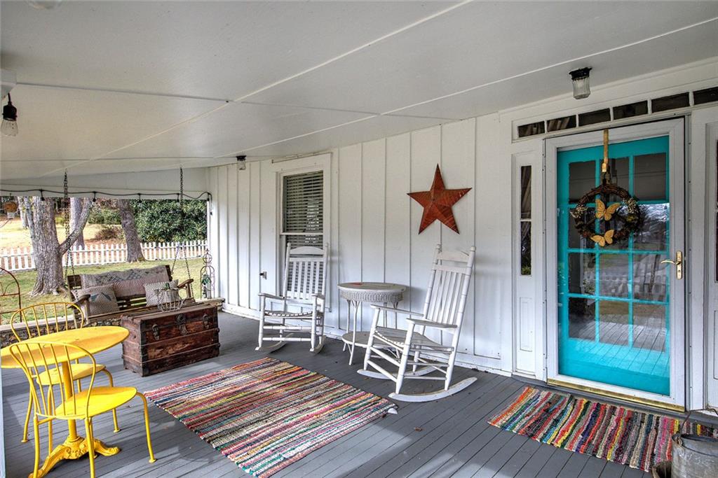 401 Edison Street Menlo, GA 30731 - Photo 8 of 34 a living room with furniture a flat screen tv and a table