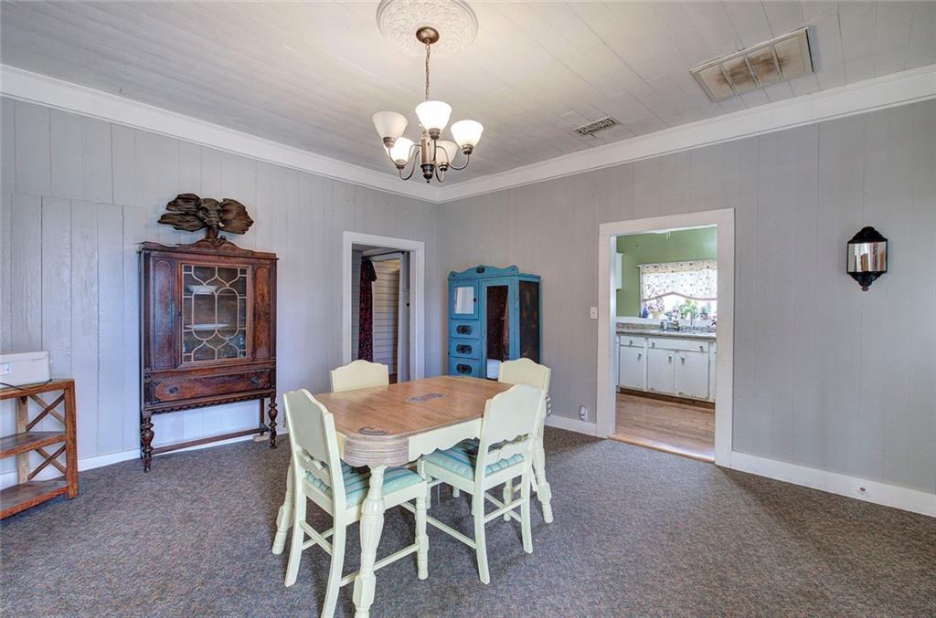 401 Edison Street Menlo, GA 30731 - Photo 9 of 34 a dining room with furniture a chandelier and window