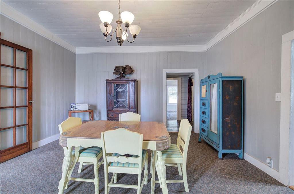 401 Edison Street Menlo, GA 30731 - Photo 10 of 34 a view of a dining room with furniture and chandelier