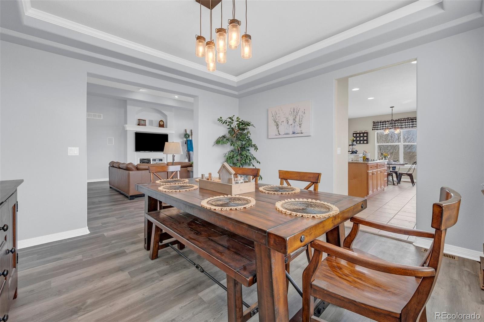 2382 Antelope Ridge Trail Parker, CO 80138 - Photo 11 of 49 a view of a dining room with furniture and wooden floor