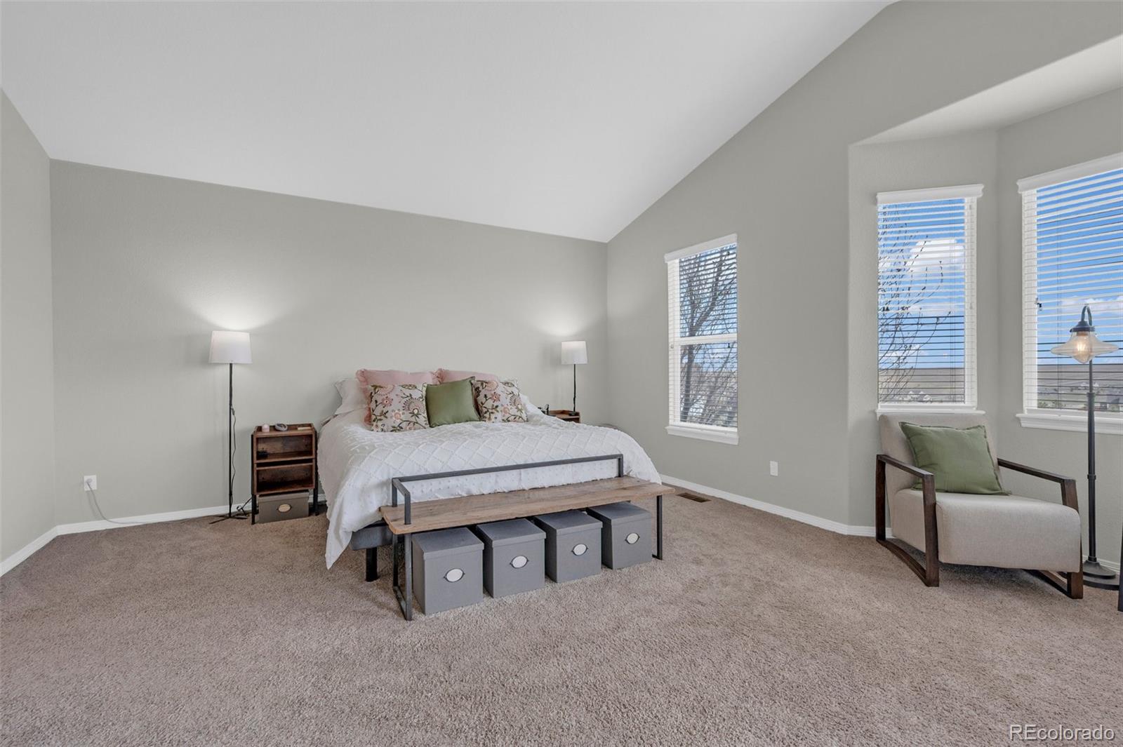 2382 Antelope Ridge Trail Parker, CO 80138 - Photo 12 of 34 a bedroom with a bed and a chair