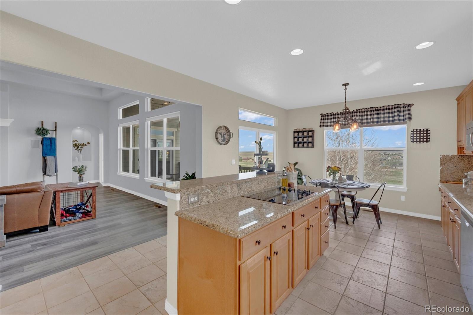 2382 Antelope Ridge Trail Parker, CO 80138 - Photo 15 of 49 a view of a dining table chairs and chandelier