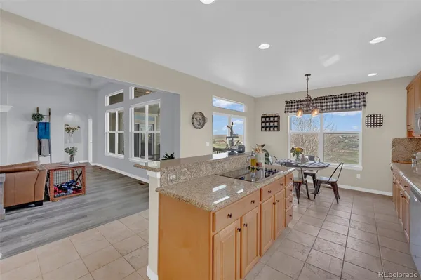 a view of a dining table chairs and chandelier