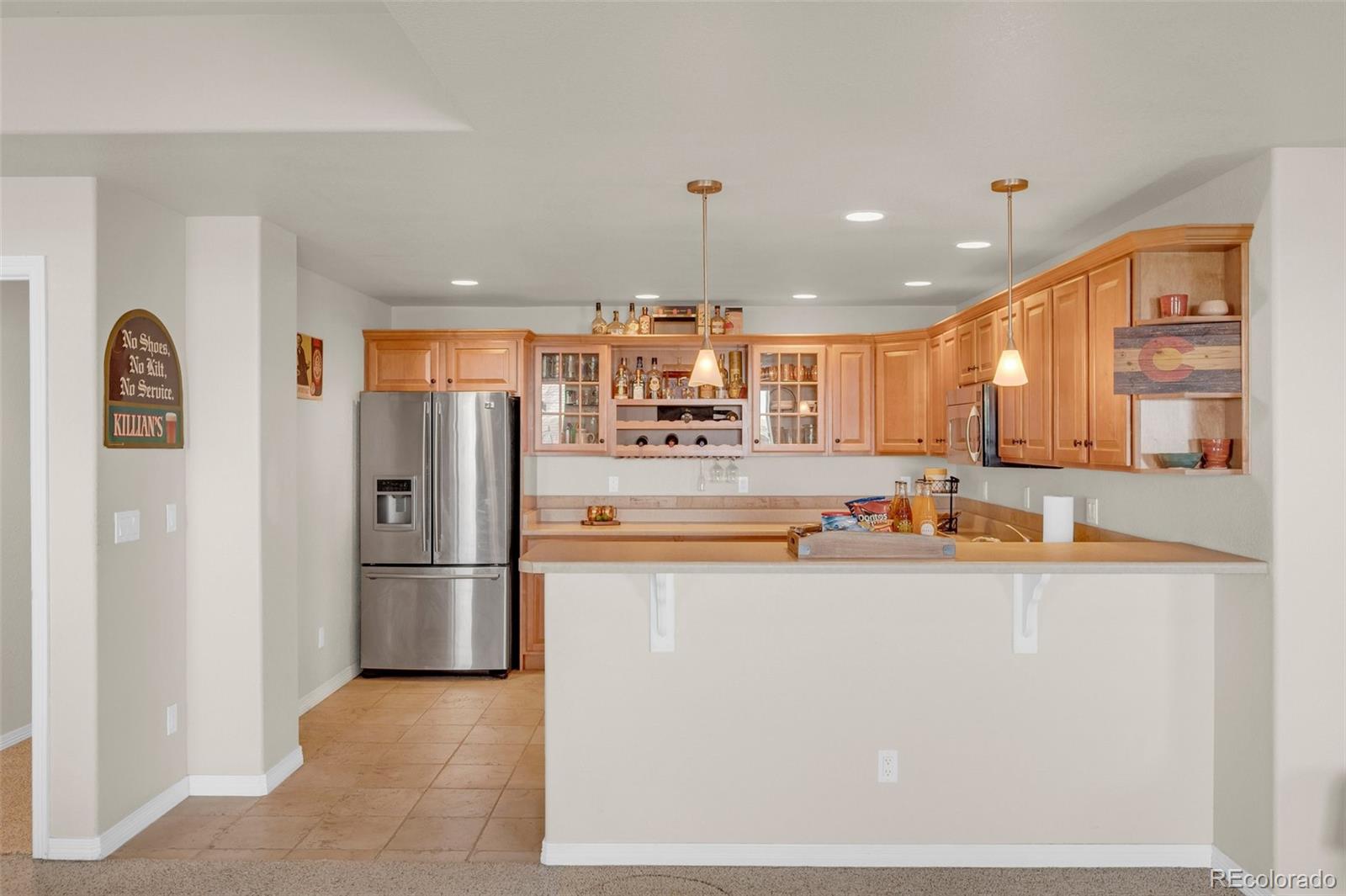 2382 Antelope Ridge Trail Parker, CO 80138 - Photo 23 of 34 a kitchen with stainless steel appliances granite countertop a refrigerator and a stove top oven