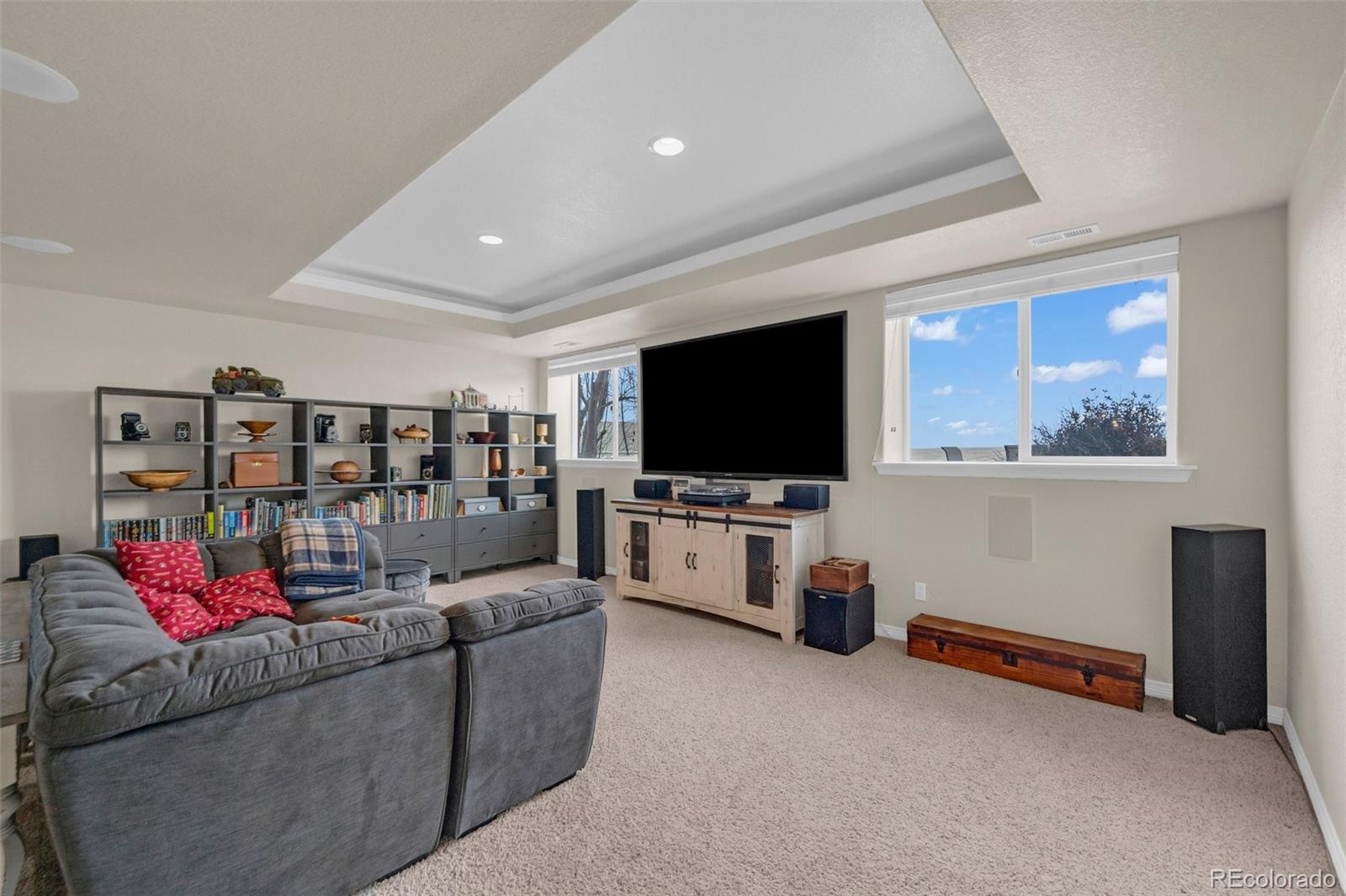 2382 Antelope Ridge Trail Parker, CO 80138 - Photo 25 of 34 a living room with furniture and a flat screen tv