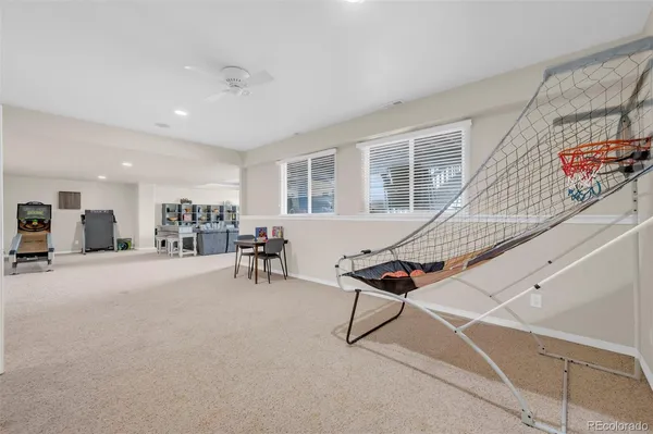 a living room with furniture a table and chairs