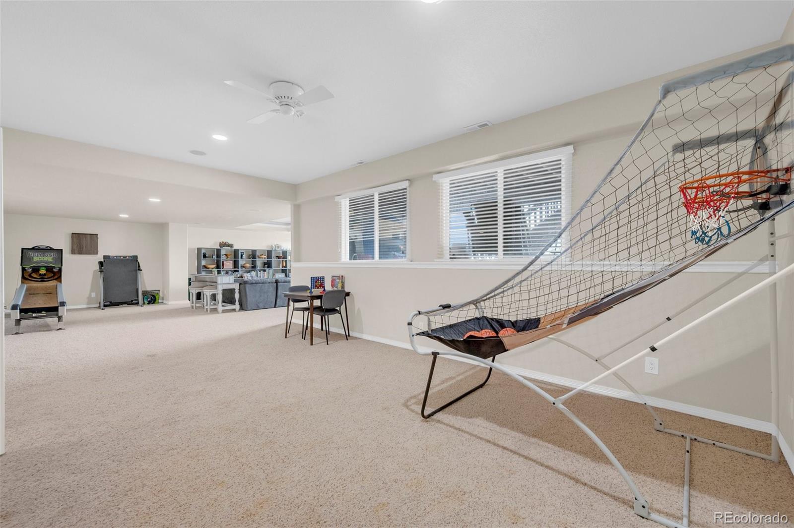 2382 Antelope Ridge Trail Parker, CO 80138 - Photo 39 of 49 a living room with furniture a table and chairs