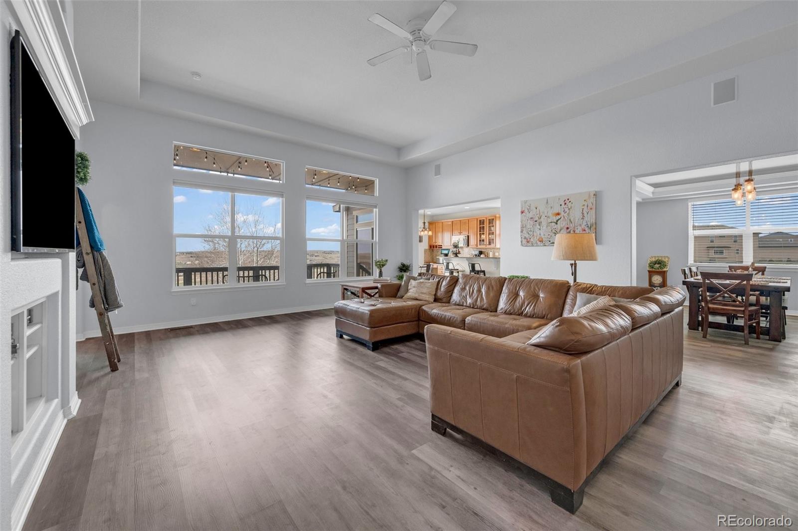 2382 Antelope Ridge Trail Parker, CO 80138 - Photo 7 of 34 a living room with furniture and a flat screen tv