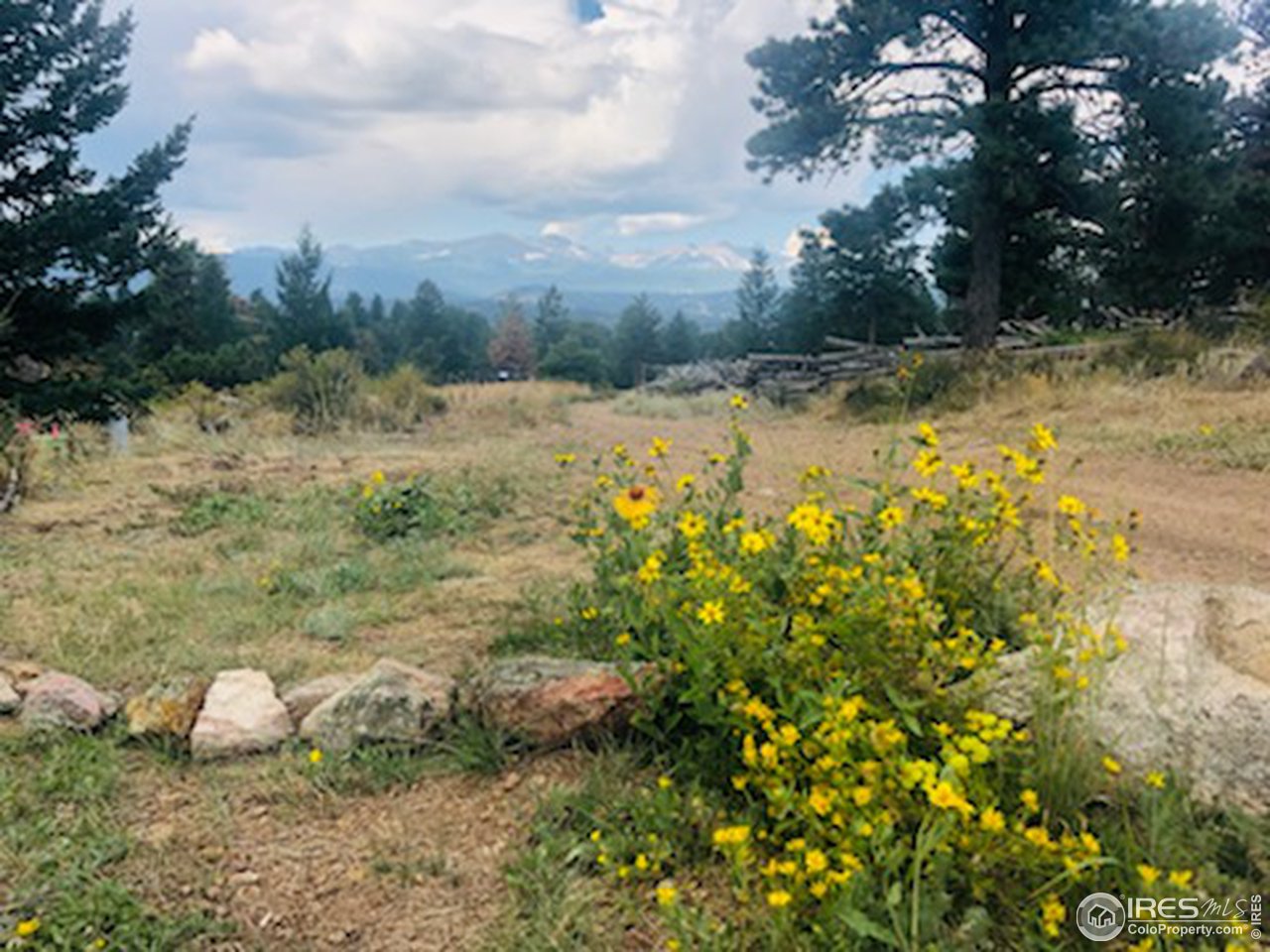 4659 Ridge Road Boulder, CO 80302 - Photo 2 of 7 a view of a yard with wooden fence