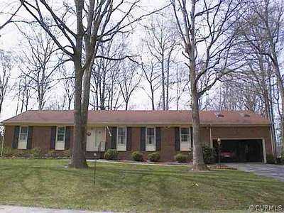 4024 Belspring Road Chester, VA 23831 - Photo 1 of 1 a front view of a brick building with a yard