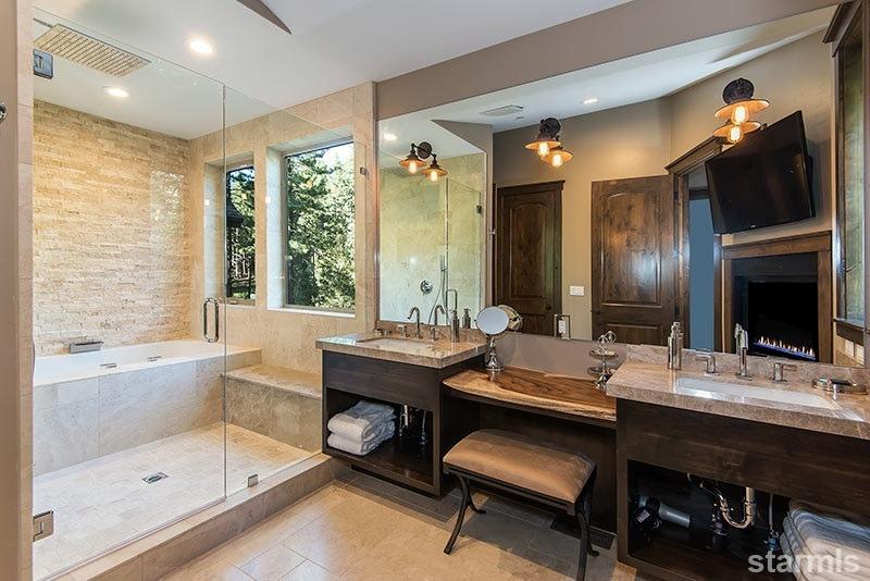 3739 Saddle Road South Lake Tahoe, CA 96150 - Photo 14 of 25 a bathroom with a granite countertop sink a toilet and shower