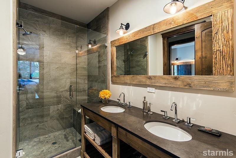 3739 Saddle Road South Lake Tahoe, CA 96150 - Photo 18 of 25 a bathroom with a sink a mirror and a shower