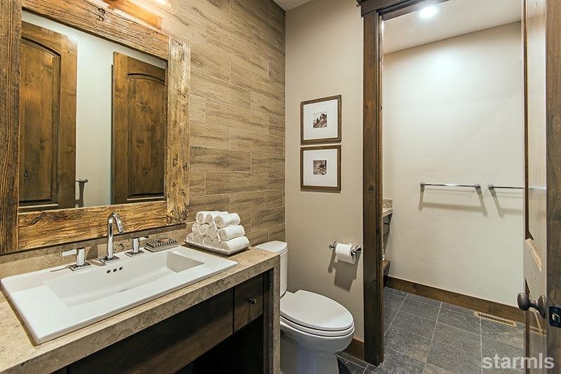 3739 Saddle Road South Lake Tahoe, CA 96150 - Photo 22 of 25 a bathroom with a sink toilet and shower