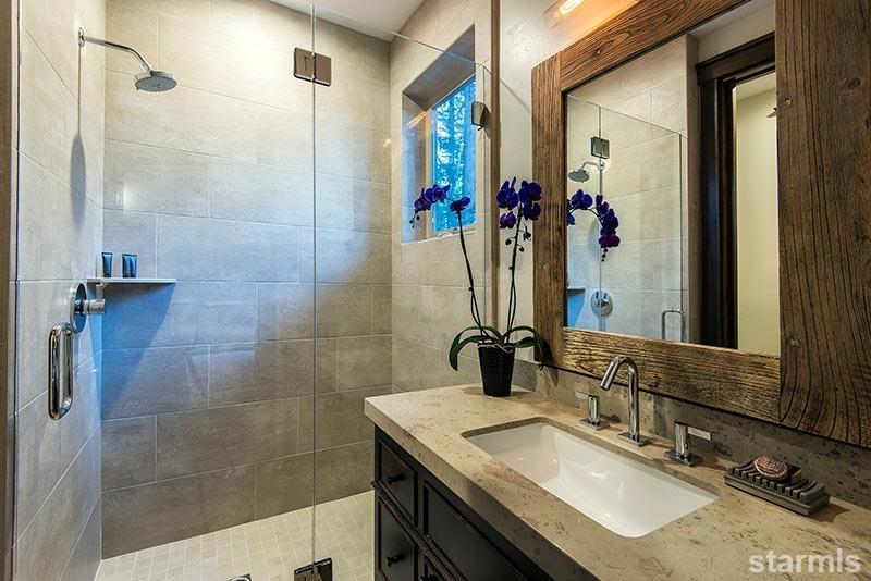 3739 Saddle Road South Lake Tahoe, CA 96150 - Photo 24 of 25 a bathroom with a granite countertop sink a mirror and a shower