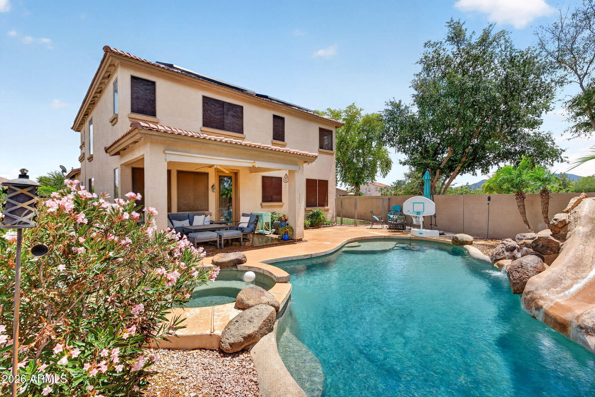 6280 South Sinova Court Gilbert, AZ 85298 - Photo 49 of 64 a view of a house with swimming pool and sitting area