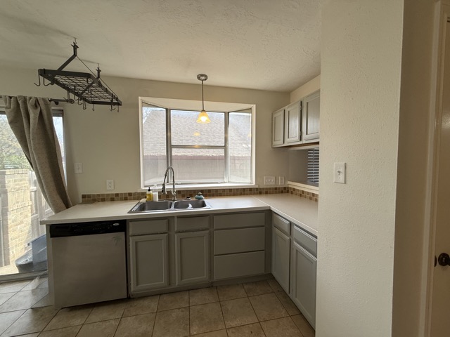 1809 Whitney Way Austin, TX 78741 - Photo 7 of 25 Kitchen sink bay windows bring warmth and enjoyment to this spacious kitchen and prep area.