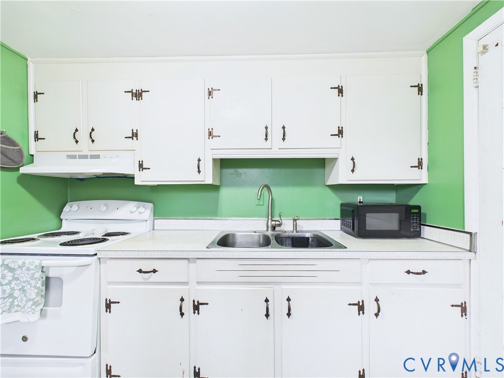 4868 Promise Land Road Appomattox, VA 24522 - Photo 10 of 43 Kitchen featuring white cabinetry with dark hardwa
