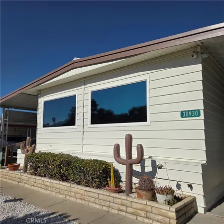 a view of a door of a house with a patio