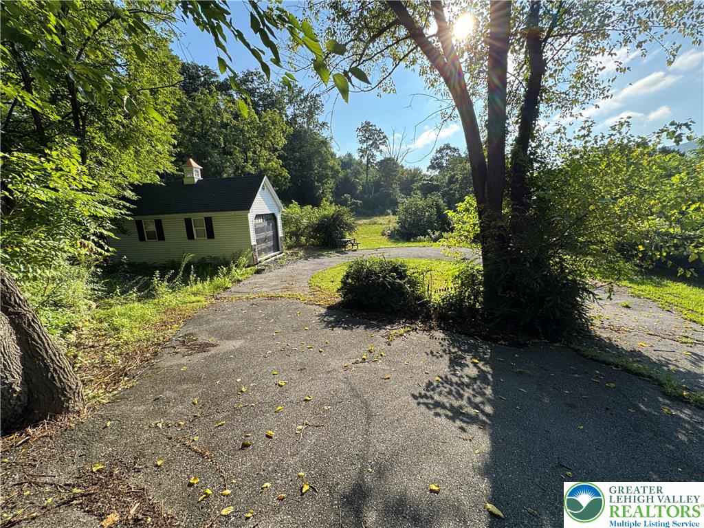 1212 3rd Street Palmerton, PA 18071 - Photo 1 of 5 a front view of a house with a yard
