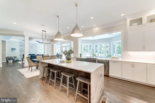 a large kitchen with lots of counter space sink and appliances