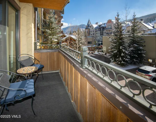 a view of balcony with furniture