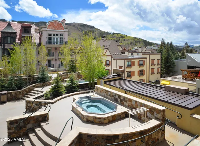 a front view of residential houses with yard