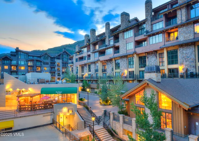a view of a building with sitting area