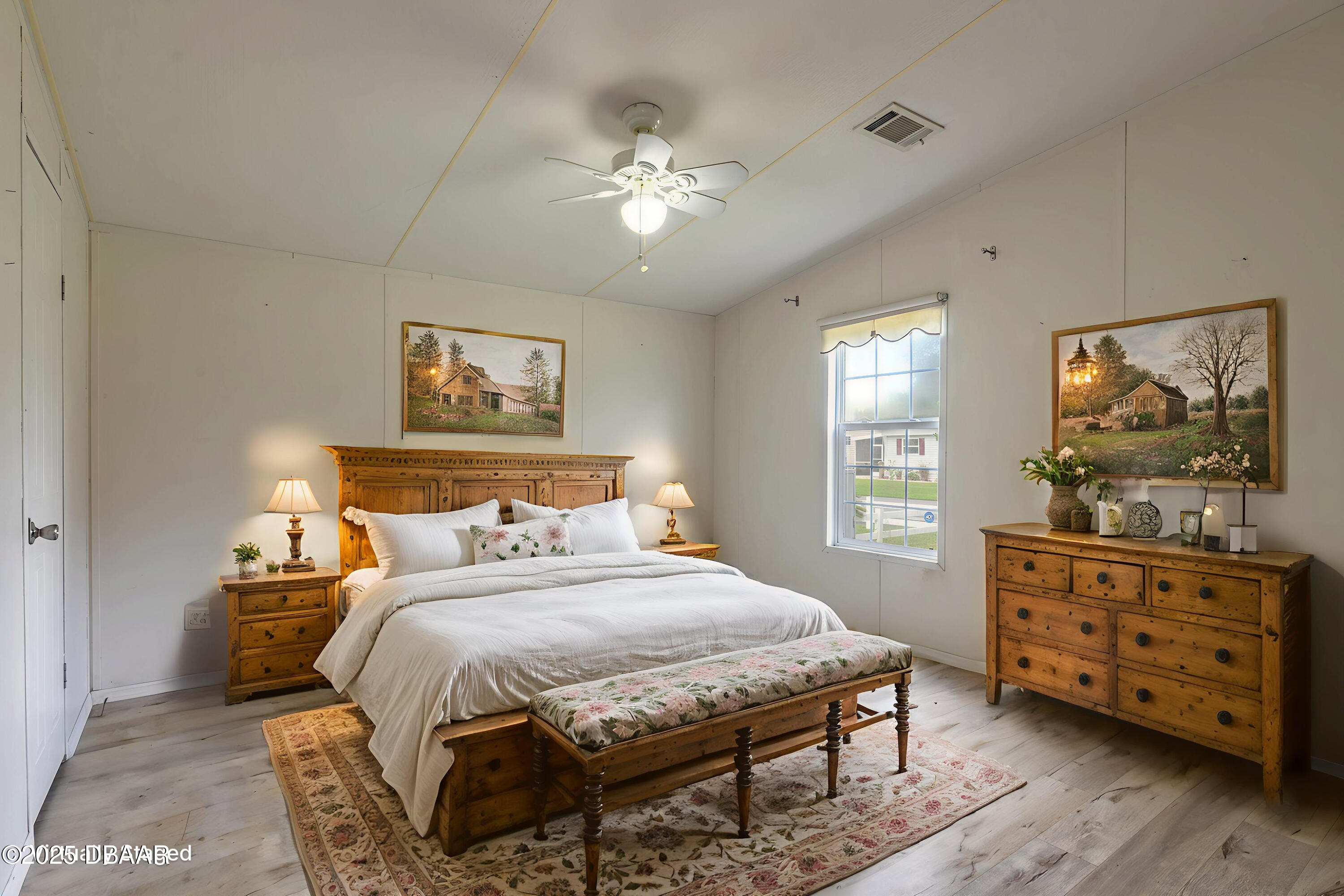 55721 Palmetto Road Astor, FL 32102 - Photo 18 of 27 a bedroom with a bed and wooden floor
