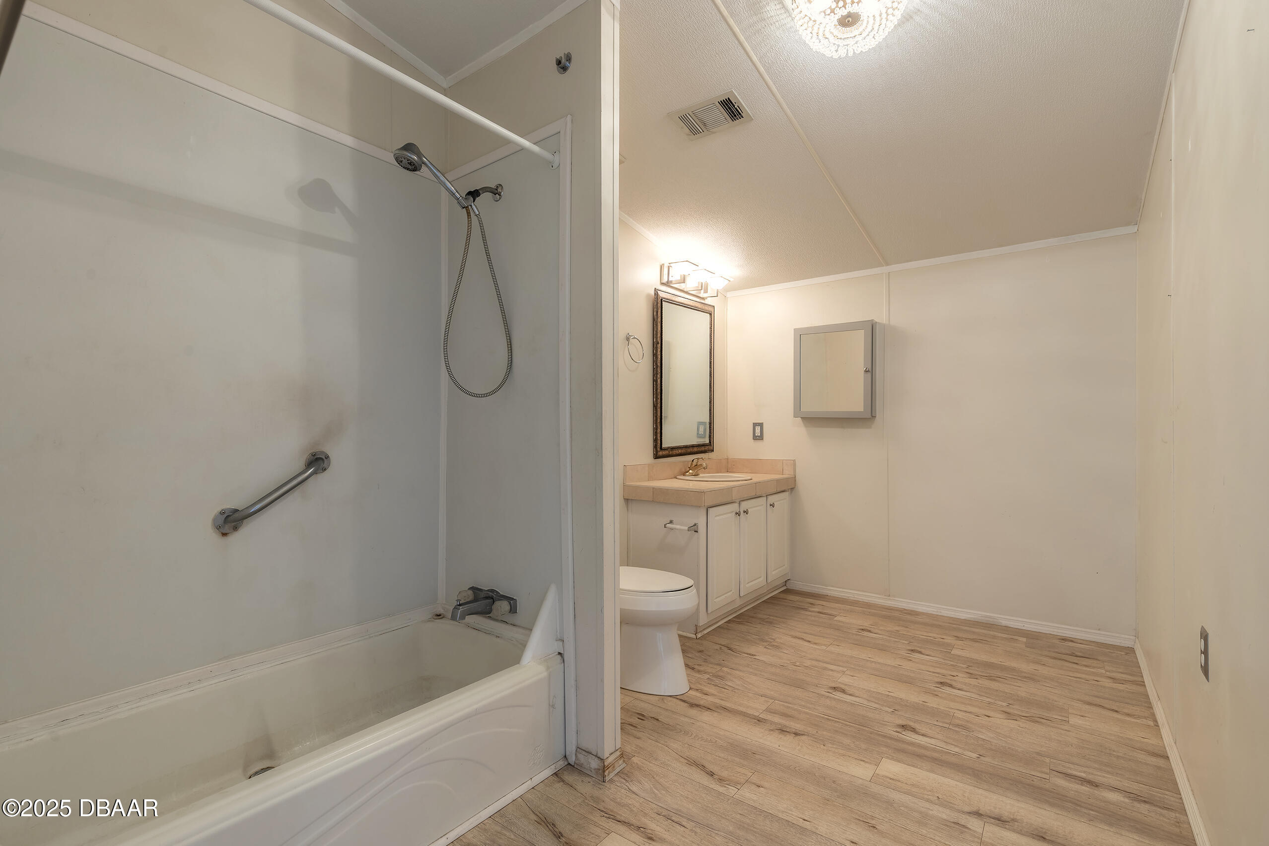 55721 Palmetto Road Astor, FL 32102 - Photo 20 of 27 a bathroom with a sink a toilet and shower