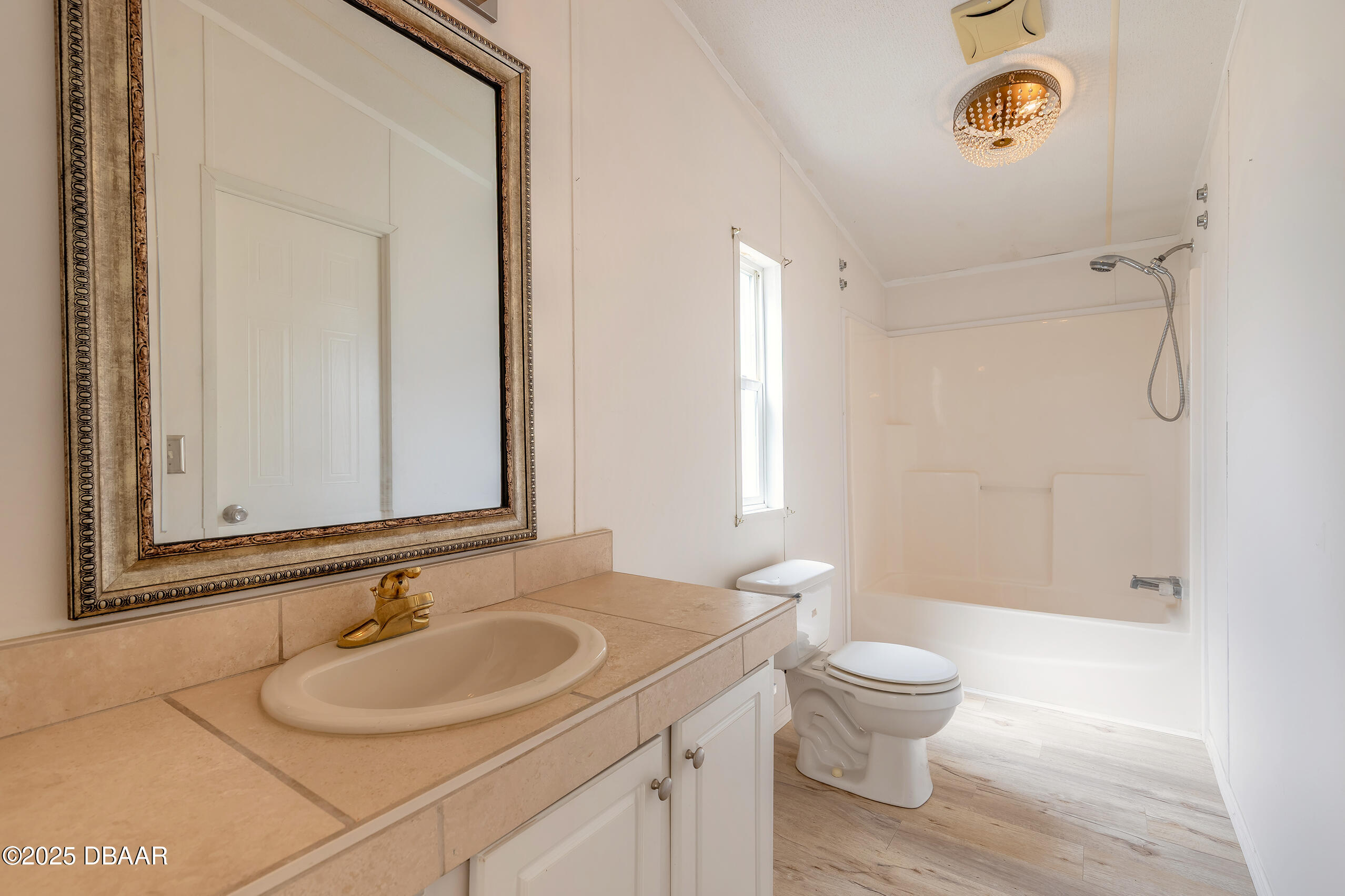 55721 Palmetto Road Astor, FL 32102 - Photo 24 of 27 a bathroom with a sink toilet and shower