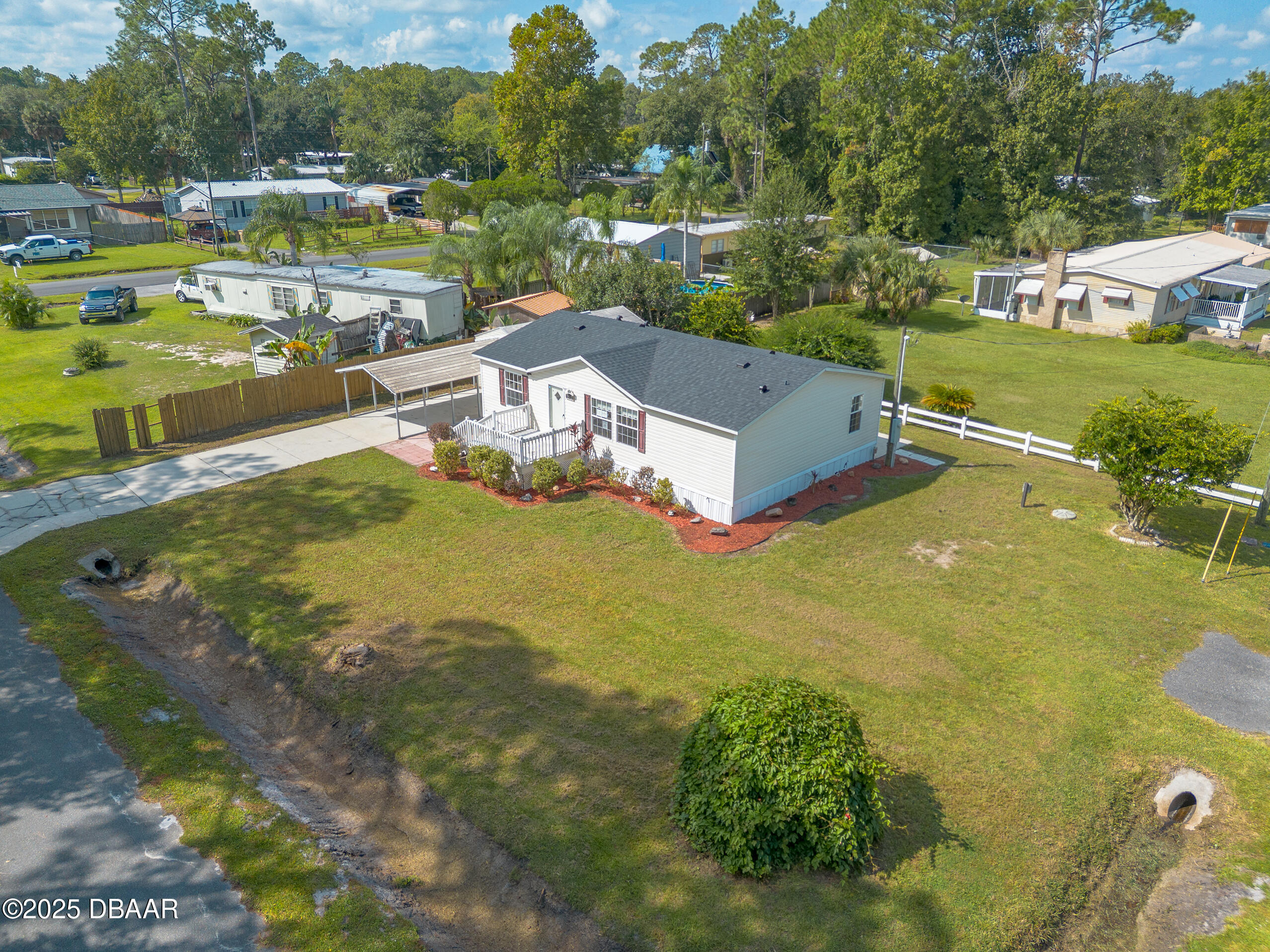 55721 Palmetto Road Astor, FL 32102 - Photo 25 of 27 a view of a lake with a yard
