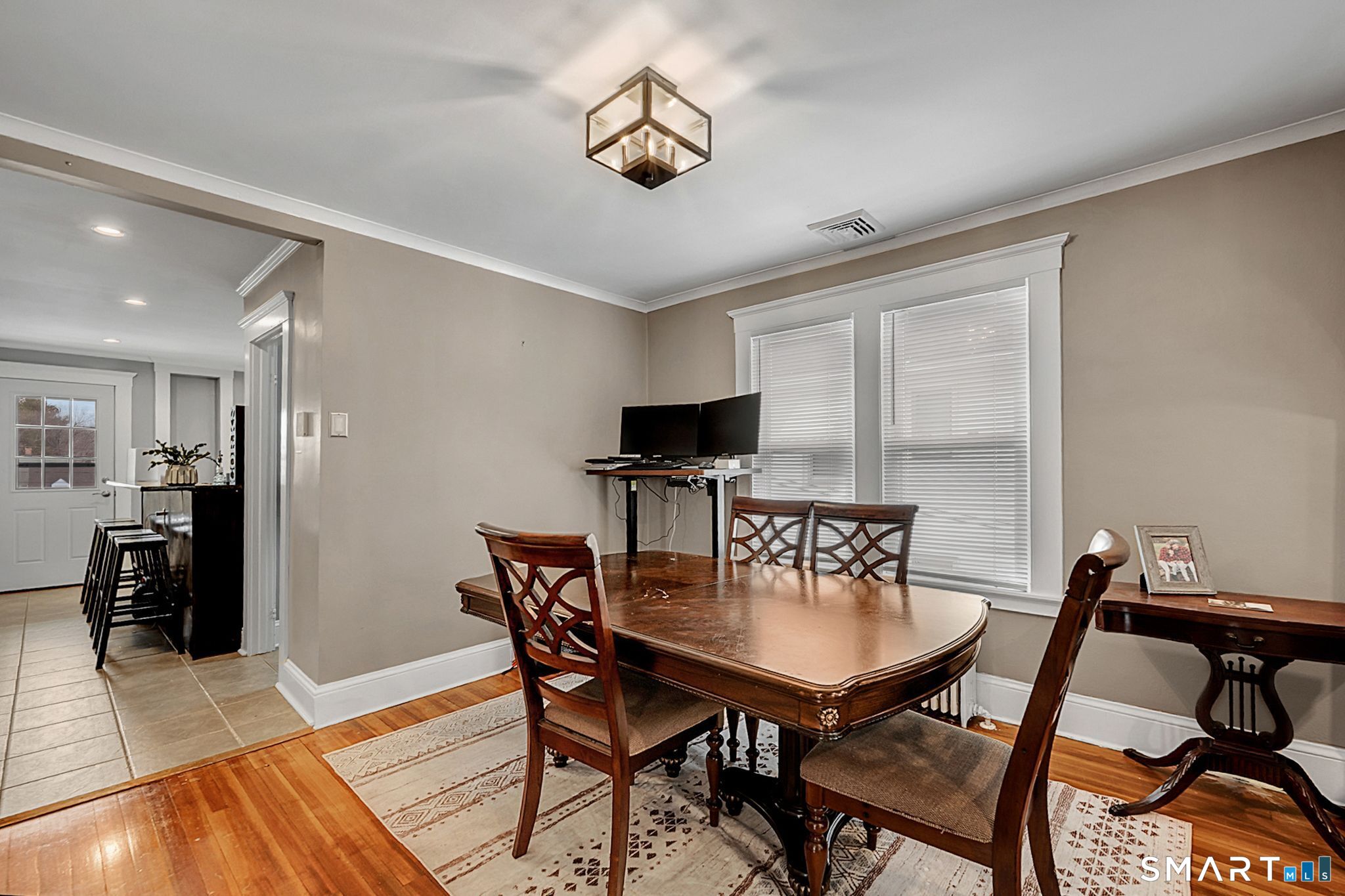 64 Cooper Street Torrington, CT 06790 - Photo 11 of 26 a view of a dining room with furniture and wooden floor