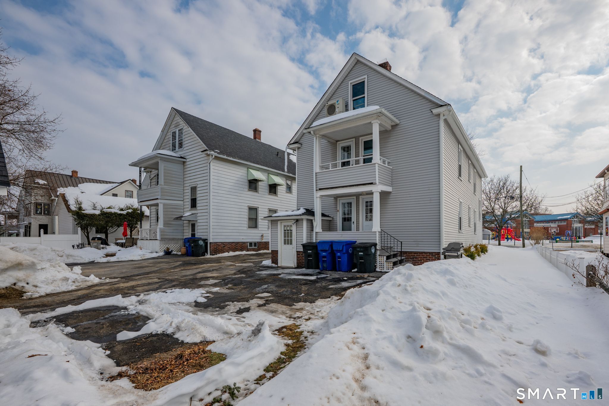 64 Cooper Street Torrington, CT 06790 - Photo 2 of 26 a view of a street with buildings