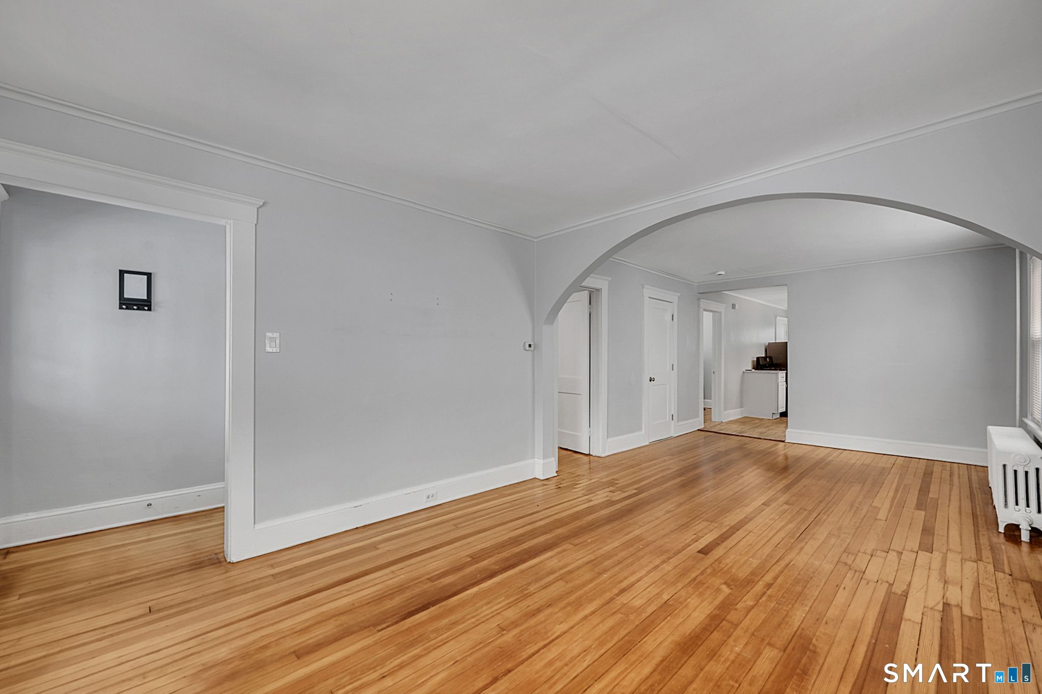 64 Cooper Street Torrington, CT 06790 - Photo 3 of 26 a view of empty room with wooden floor