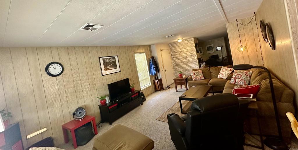 8301 Mission Gorge Road, Unit 194 Santee, CA 92071 - Photo 11 of 61 a living room with furniture and a flat screen tv