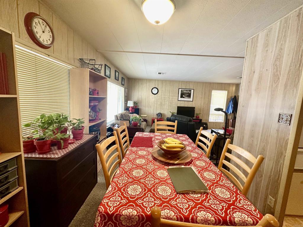 8301 Mission Gorge Road, Unit 194 Santee, CA 92071 - Photo 14 of 61 a view of a dining room with furniture window and wooden floor